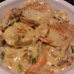 Noix de Saint-Jacques flambées au Calvados et fondue de Poireaux