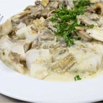 Filet de lieu noir aux champignons sauce crémeuse